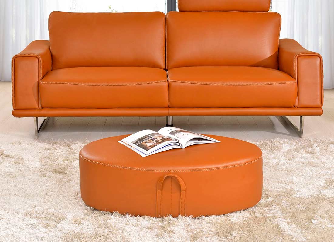 leather chair black next to the orange sofa